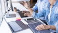 Young startup Programmers Sitting At Desks Working On Computers screen for Developing programming and coding to find solution to Royalty Free Stock Photo