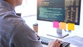 Young startup Programmers Sitting At Desks Working On Computers screen for Developing programming and coding to find solution to Royalty Free Stock Photo