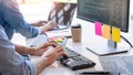 Young startup Programmers Sitting At Desks Working On Computers screen for Developing programming and coding to find solution to Royalty Free Stock Photo
