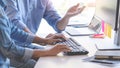 Young startup Programmers Sitting At Desks Working On Computers screen for Developing programming and coding to find solution to Royalty Free Stock Photo