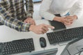 Young startup Programmers Sitting At Desks Working On Computers screen for Developing programming and coding to find solution to Royalty Free Stock Photo