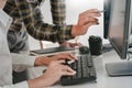 Young startup Programmers Sitting At Desks Working On Computers screen for Developing programming and coding to find solution to Royalty Free Stock Photo