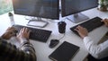 Young startup Programmers Sitting At Desks Working On Computers screen for Developing programming and coding to find solution to Royalty Free Stock Photo