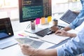 Young startup Programmers Sitting At Desks Working On Computers screen for Developing programming and coding to find solution to Royalty Free Stock Photo