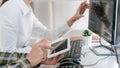 Young startup Programmers Sitting At Desks Working On Computers screen for Developing programming and coding to find solution to Royalty Free Stock Photo