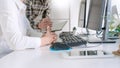 Young startup Programmers Sitting At Desks Working On Computers screen for Developing programming and coding to find solution to Royalty Free Stock Photo