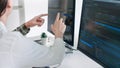 Young startup Programmers Sitting At Desks Working On Computers screen for Developing programming and coding to find solution to Royalty Free Stock Photo