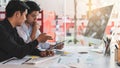 Young startup ux ui front end designers developing programming and coding responsive web content or mobile app from prototype and Royalty Free Stock Photo