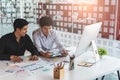Young startup ux ui front end designers developing programming and coding responsive web content or mobile app from prototype and Royalty Free Stock Photo