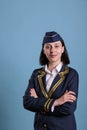 Young stewardess wearing aviation uniform portrait