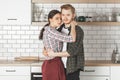 Young straight caucasian couple on kitchen