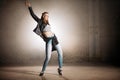 Young street woman doing movements with hips. hip action Royalty Free Stock Photo