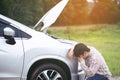 young stressed man having trouble with his Stress broken car Royalty Free Stock Photo