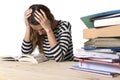 Young stressed student girl studying and preparing MBA test exam in stress tired and overwhelmed Royalty Free Stock Photo