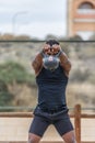 Fit sportsman performing kettlebell swing exercise during workout Royalty Free Stock Photo