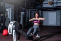 Young strong fit sweaty powerful attractive muscular woman with big muscles doing hard core row heavy cross training workout on in Royalty Free Stock Photo