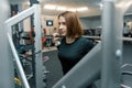 Young strong fitness woman doing strength exercises with heavy weight barbell in sport gym. Sport, weightlifting, bodybuilding, Royalty Free Stock Photo