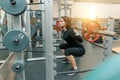 Young strong fitness woman doing strength exercises with heavy weight barbell in sport gym. Sport, weightlifting, bodybuilding, Royalty Free Stock Photo