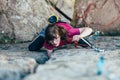 Young slender climber climbs a rock Royalty Free Stock Photo