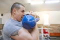 Young strong muscular athlete bodybuilder lifts weights in the gym, weight training Royalty Free Stock Photo