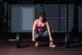 Young strong muscular fit girl with big muscles preparing for hard strength weightlifing or dead lift cross workout training with Royalty Free Stock Photo