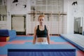 young strong preatty, parkour, woman is standing in front of an obstacle and getting ready to jump Royalty Free Stock Photo