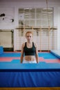 young strong preatty, parkour, woman is standing in front of an obstacle and getting ready to jump Royalty Free Stock Photo