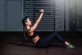 Young strong serious sweaty focused athlete fit muscular woman with big muscles holding heavy kettlebell weight barbell dumbbell Royalty Free Stock Photo