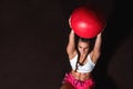 Young strong serious sweaty focused athlete fit muscular woman with big muscles holding heavy kettlebell weight barbell dumbbell Royalty Free Stock Photo