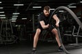 Young strong sports man make sport exercises in gym Royalty Free Stock Photo