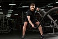 Young strong sports man make sport exercises in gym Royalty Free Stock Photo