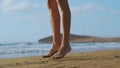 Young strong woman in sportswear doing plyometric exercises on pier. Jump squats, fitness workout outdoors. SLOW MOTION