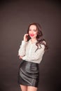 Young student businesswoman in a white blouse on a black background. the concept of education finance business Royalty Free Stock Photo