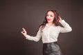 Young student businesswoman in a white blouse on a black background. the concept of education finance business Royalty Free Stock Photo