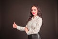 Young student businesswoman in a white blouse on a black background. the concept of education finance business Royalty Free Stock Photo