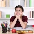 Young student day dreaming and thinking at school Royalty Free Stock Photo