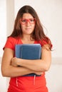 Young student geek woman in red t shirt with yeyglasses dissappointed or stressed