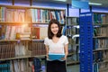 Young student girl asian holding book