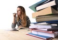 Young student girl concentrated studying for exam at college library education concept