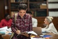 Young student girl studying in library Royalty Free Stock Photo