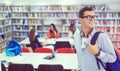 the student uses a notebook, latop and a school library Royalty Free Stock Photo