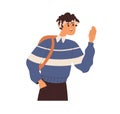 Young student greeting with hi gesture, waving with hand. Happy smiling schoolboy saying hello, standing with backpack Royalty Free Stock Photo