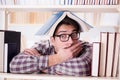 The young student looking for books in college library Royalty Free Stock Photo