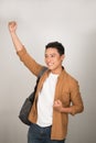 Young student man celebrating victory and success very excited, cheering emotion when passed the exam Royalty Free Stock Photo