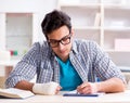 Young student man with hand injury preparing for the exams Royalty Free Stock Photo
