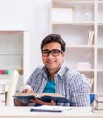 Young student man with hand injury preparing for the exams Royalty Free Stock Photo