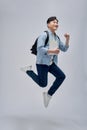 Young student man holding books celebrating a victory or success Royalty Free Stock Photo