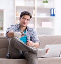 Young student man with injury at home Royalty Free Stock Photo