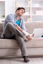 Young student man with injury at home Royalty Free Stock Photo