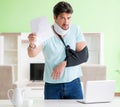 Young student man with neck and hand injury at home Royalty Free Stock Photo